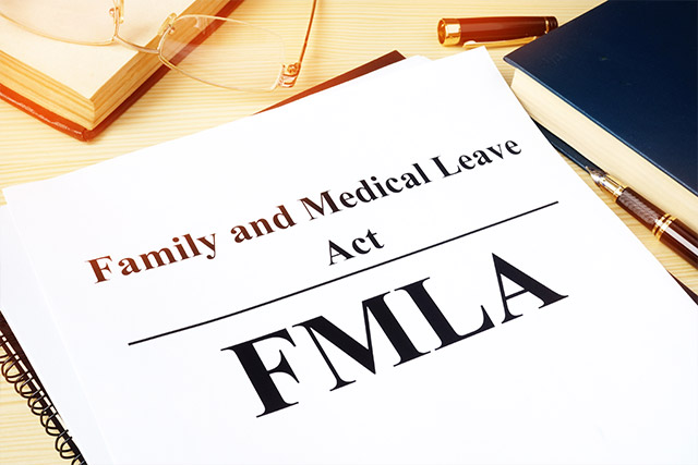 FMLA Family and Medical Leave Act pamphlet on a desk