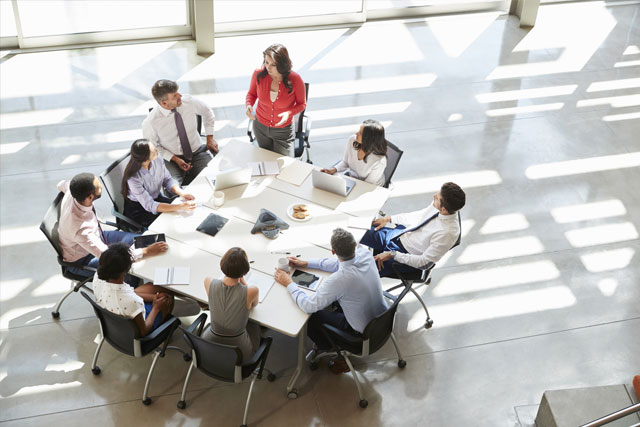 HR Board of Directors guidance around conference table leaders at Atlanta office