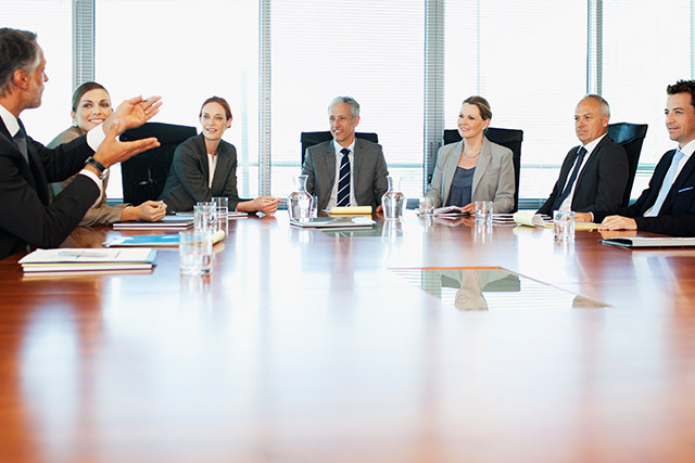 Business meeting with board of directors discussing HR organizational development