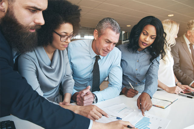 Group of HR professionals reviewing human resources consulting management practices in Atlanta, GA