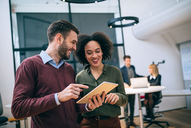 Human resources employment specialists discussing at Flex HR Atlanta office