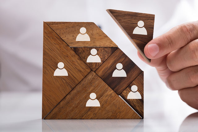 wooden puzzle showing user icons hr support